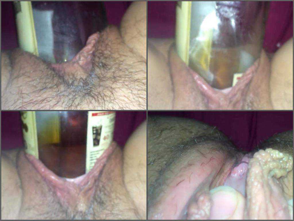 Bottle of rum penetrated deep in hairy pussy
