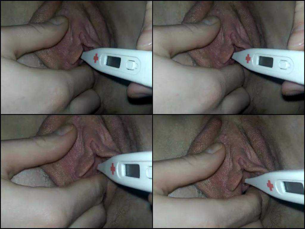Thermometer deep penetrated into peehole very closeup